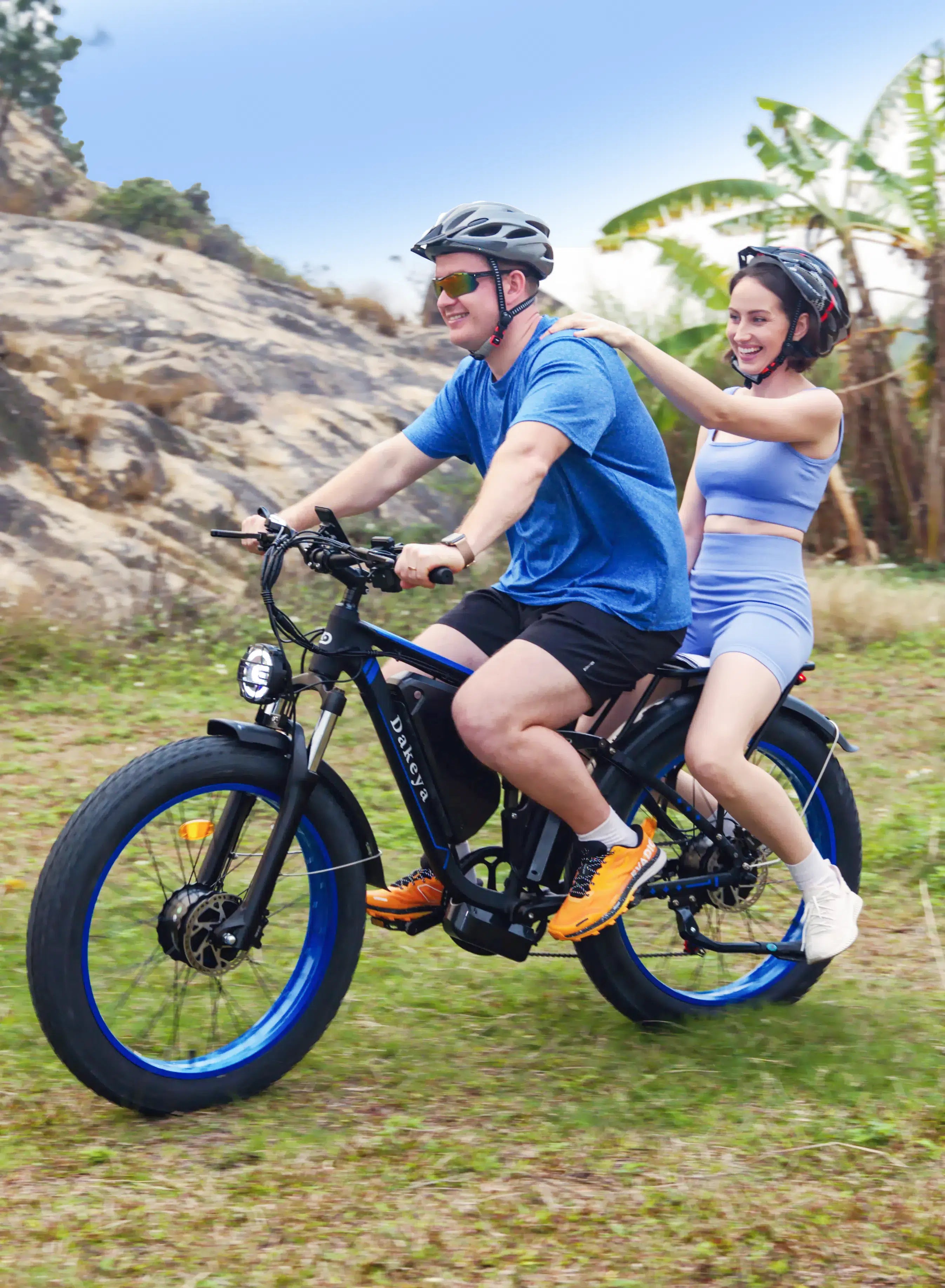Couple enjoying a trail ride on Dakeya fat tire electric bike